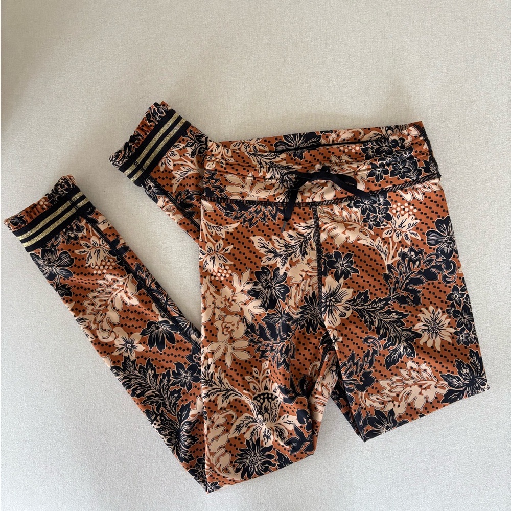 The Upside leggings drawstring floral pattern brown orange black ruffles…